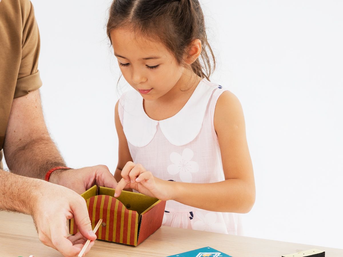 An elementary student building a Bolt Origins project