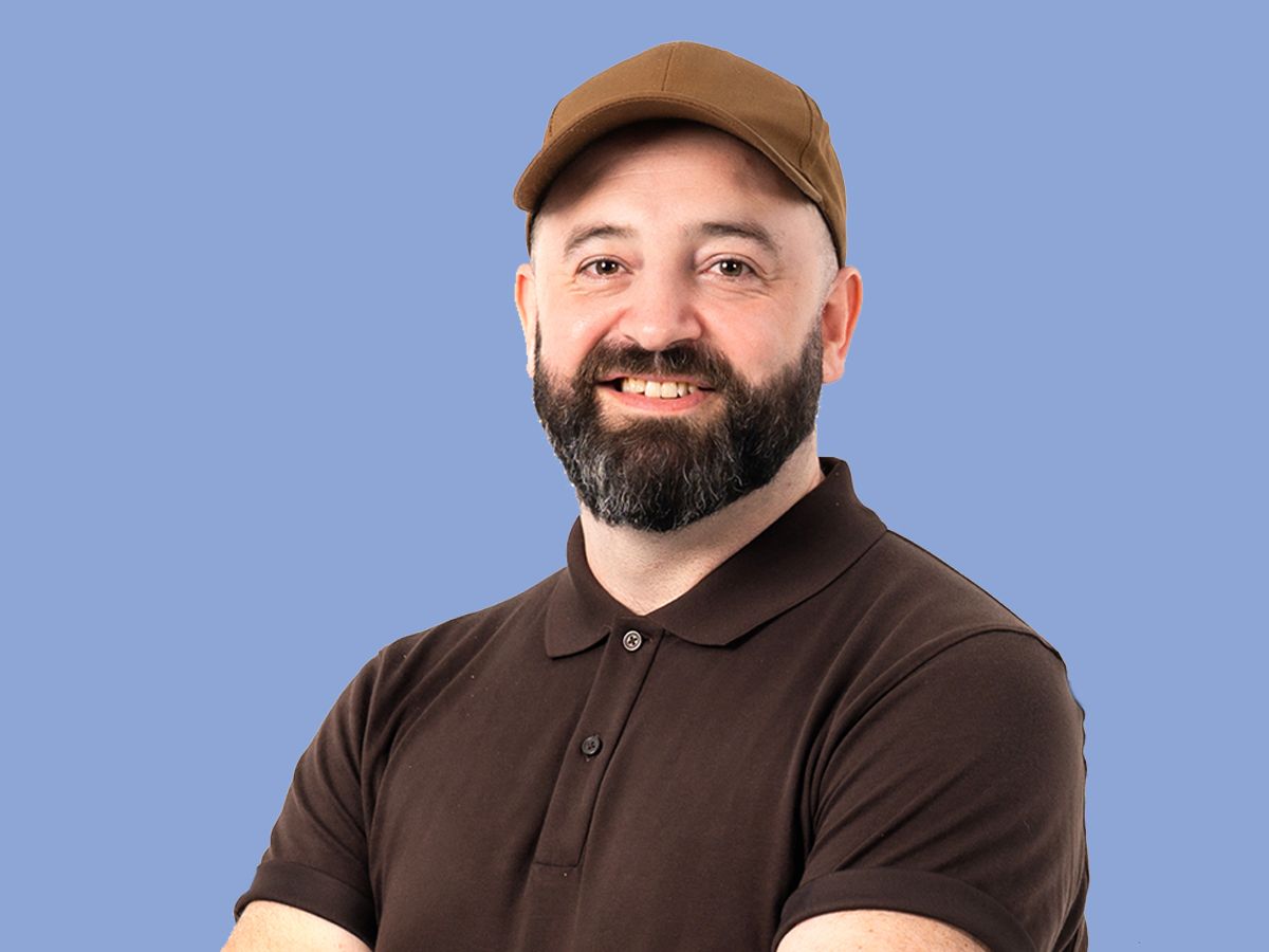 Shaun Armstrong, head and shoulders, same light and background as Chris's