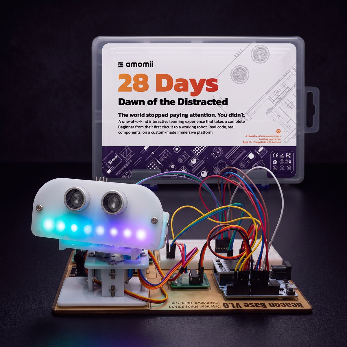 the 28 Days kit, box open, amomii ONE, breadboard and components laid out, bright background