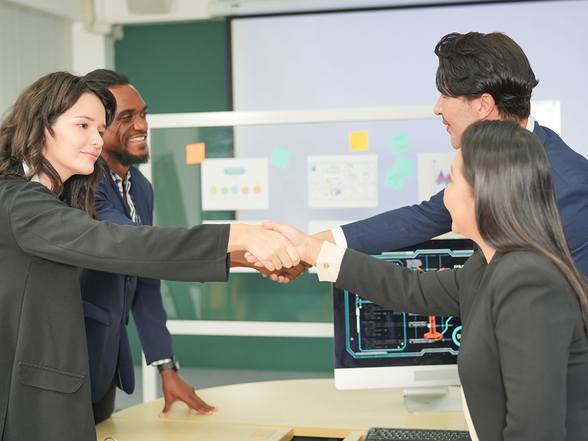 a Bolt team member visiting a classroom, helping a teacher and students mid-lesson